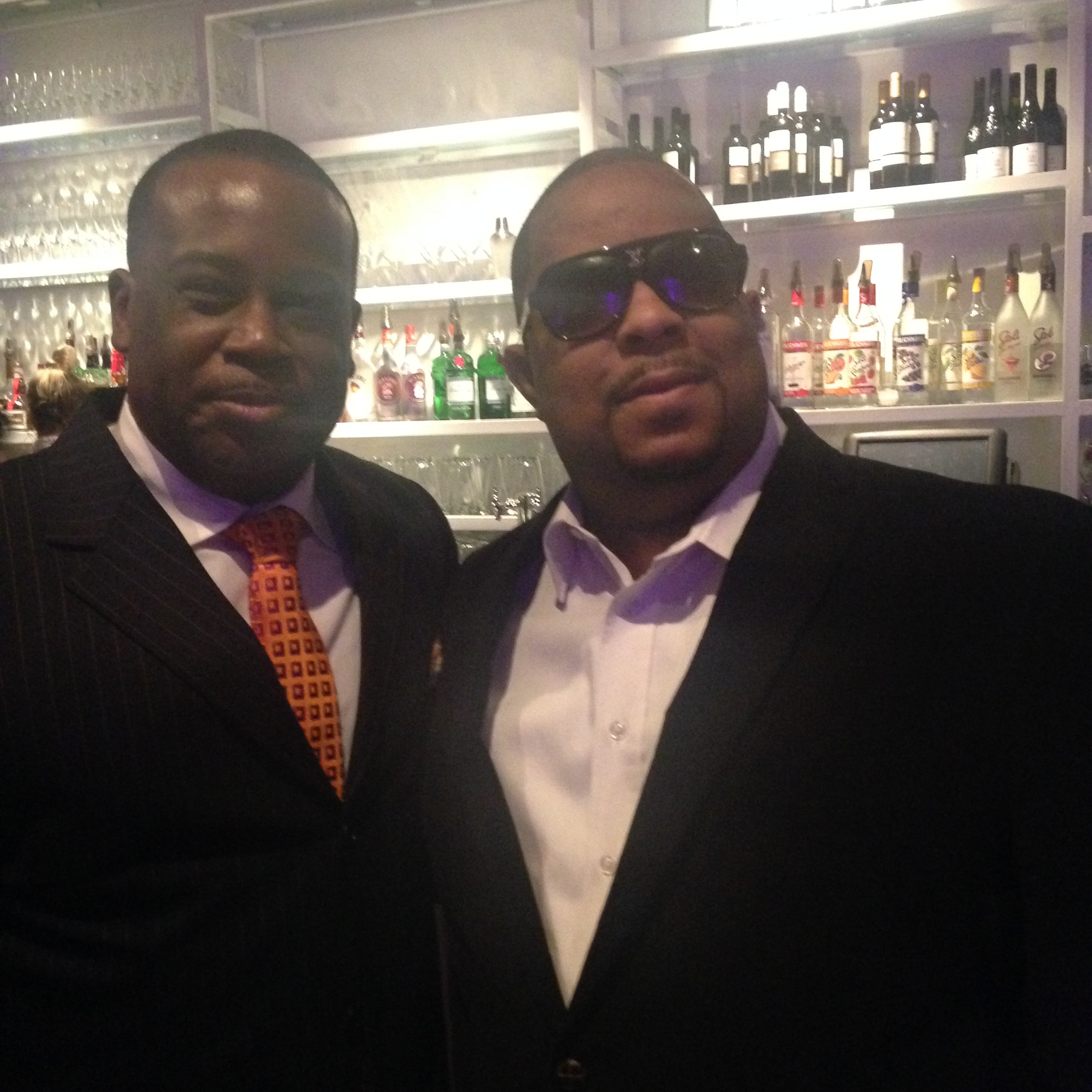 Two men posing together at an event