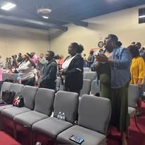 Congregation worshipping at Free Worship Ministries service
