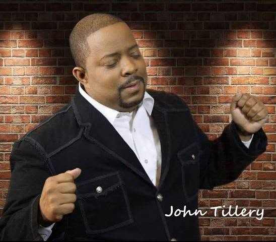 John Tillery artist portrait against brick wall
