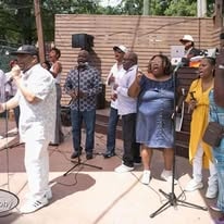 Group of gospel singers performing outdoors