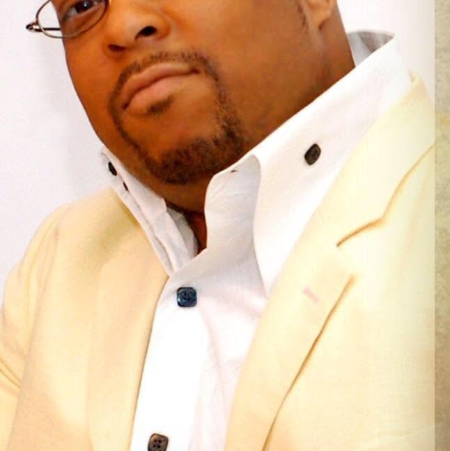 John Tillery portrait in cream blazer
