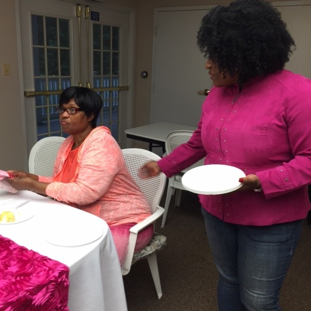 Two women serving at a ministry fellowship event