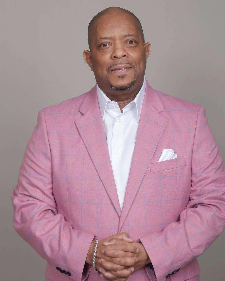 Pastor John Tillery professional portrait in pink blazer