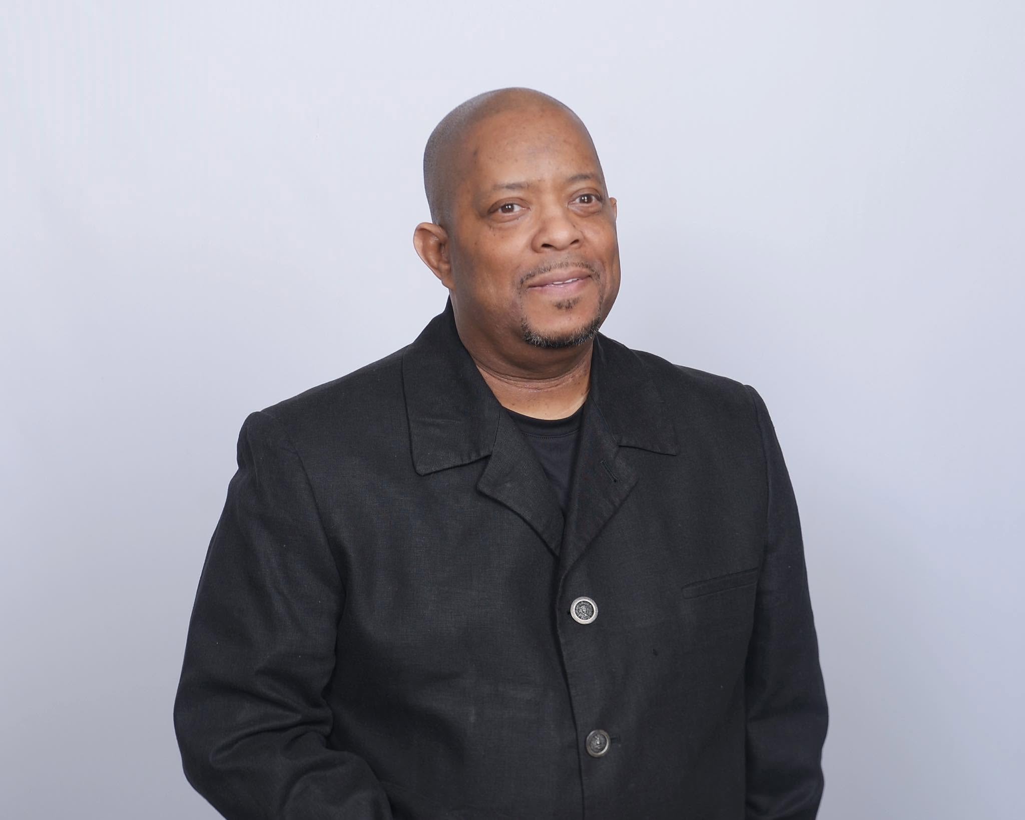 Pastor John Tillery professional portrait in black blazer